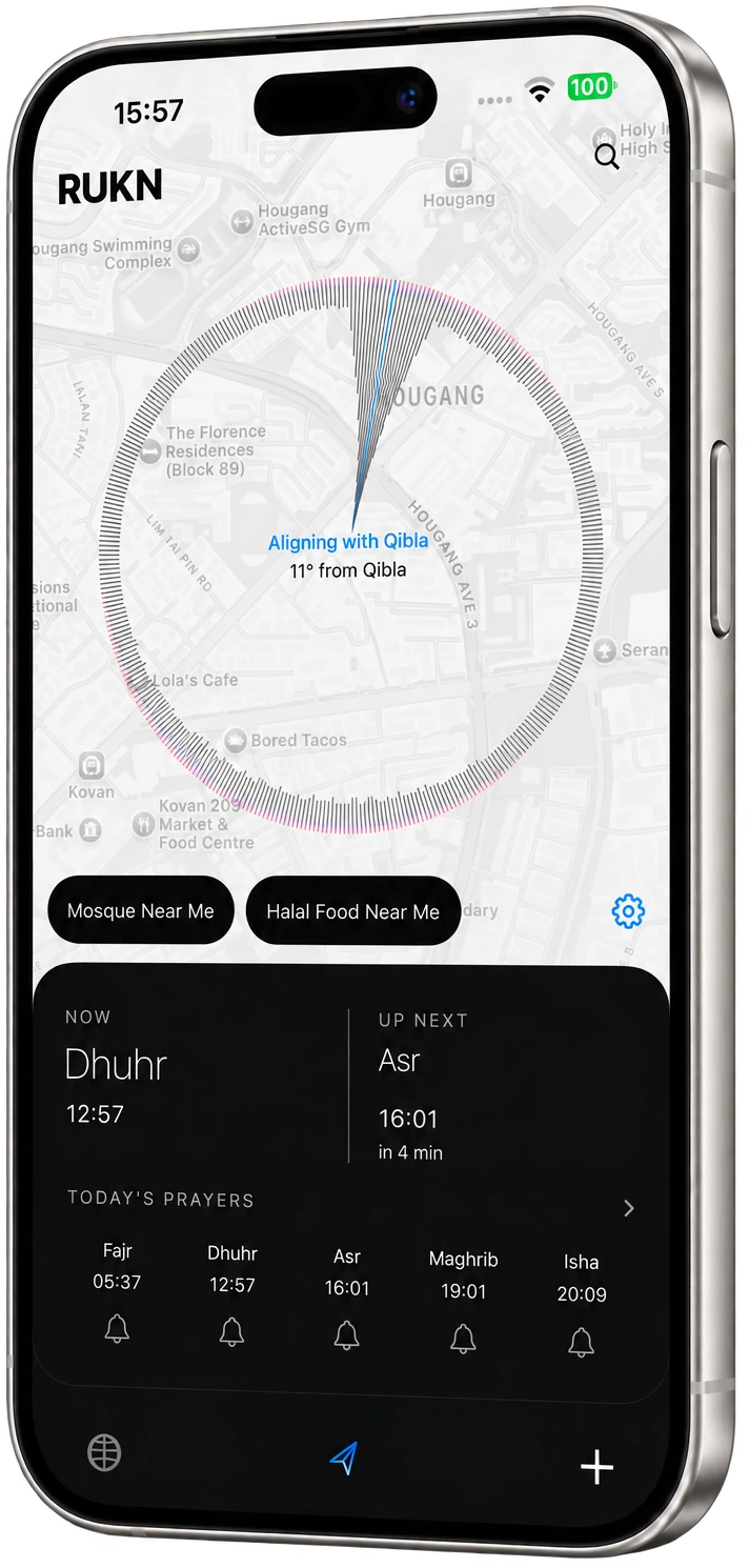 RUKN Qibla screen on a silver iPhone